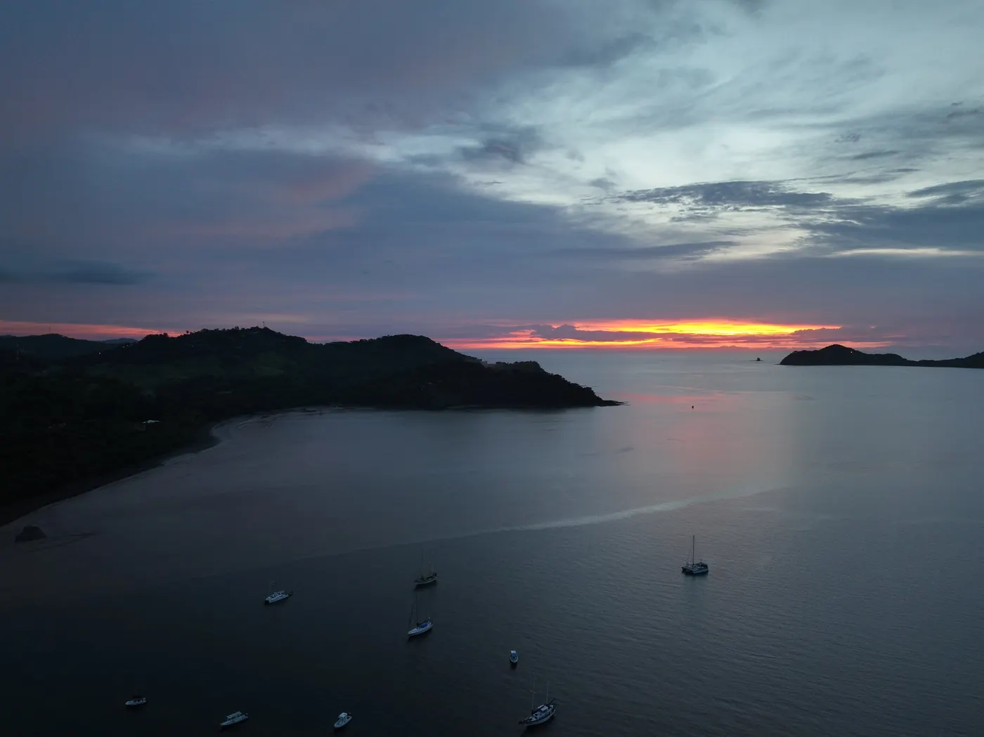 Calm sunset reflection over the bay of Playas del Coco in Guanacaste